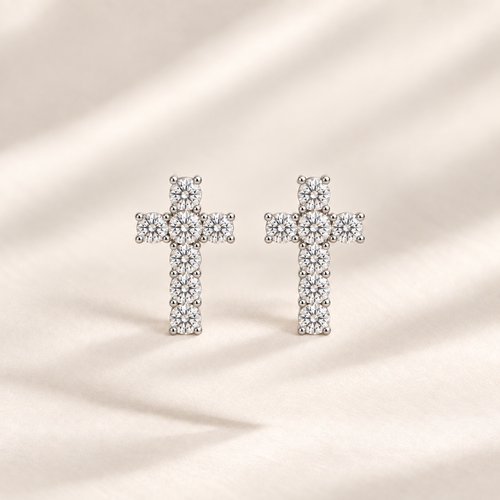 Philologi 15mm cross moissanite earrings on warm ivory silk