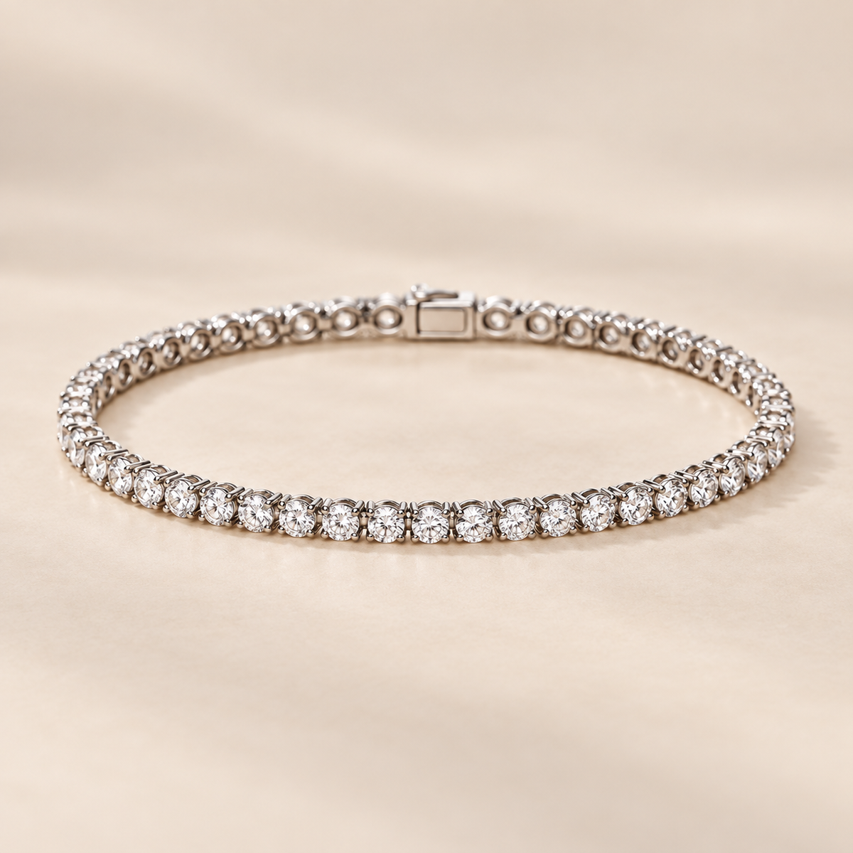 2.5mm round moissanite tennis bracelet in 925 sterling silver on warm ivory background