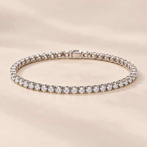2.5mm round moissanite tennis bracelet in 925 sterling silver on warm ivory background