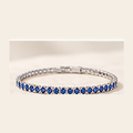 Philologi 3mm lab grown sapphire tennis bracelet on warm ivory silk