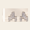 Philologi baguette moissanite stud earrings on warm ivory silk