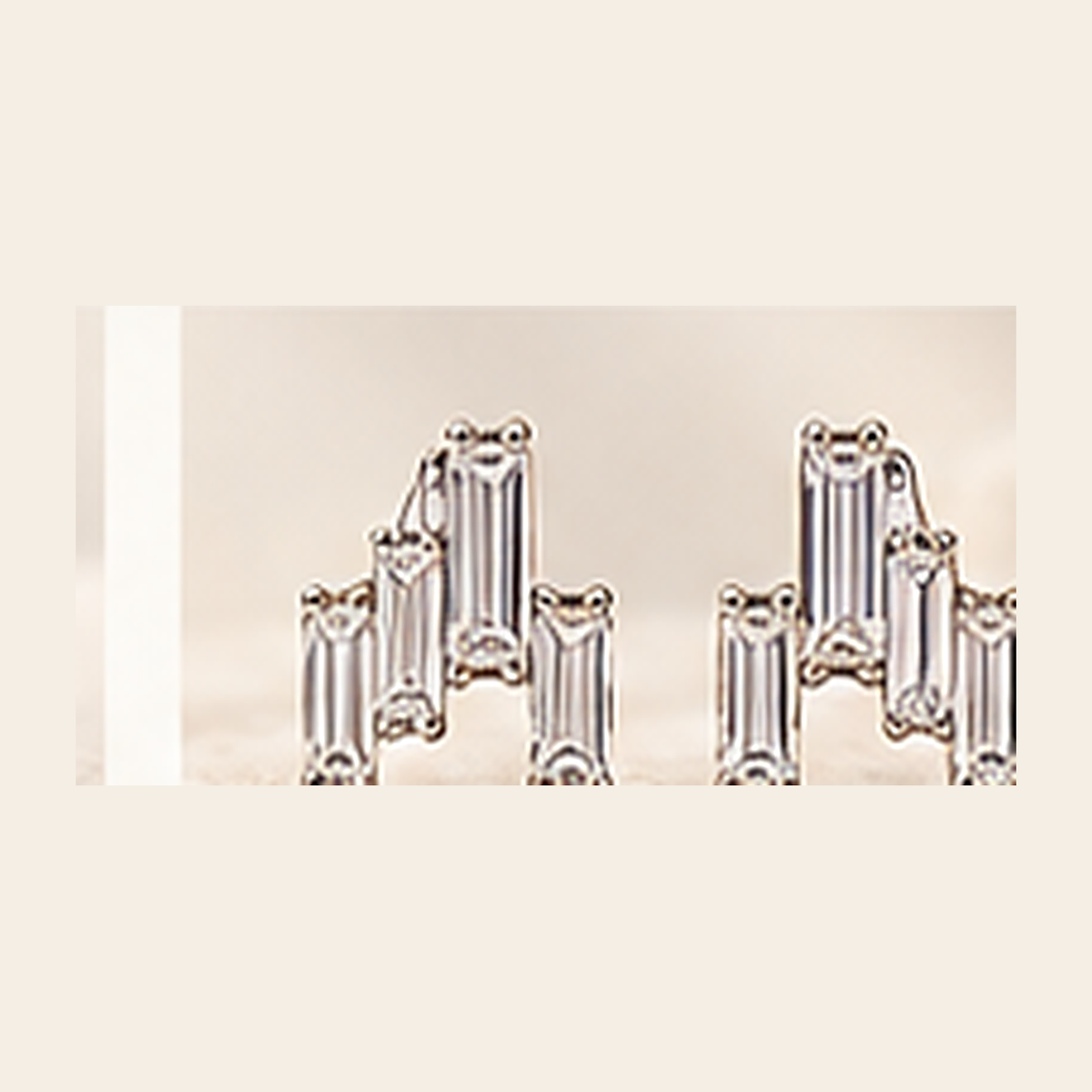 Philologi baguette moissanite stud earrings on warm ivory silk