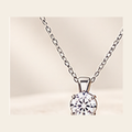 Philologi large D color moissanite solitaire necklace on warm ivory silk