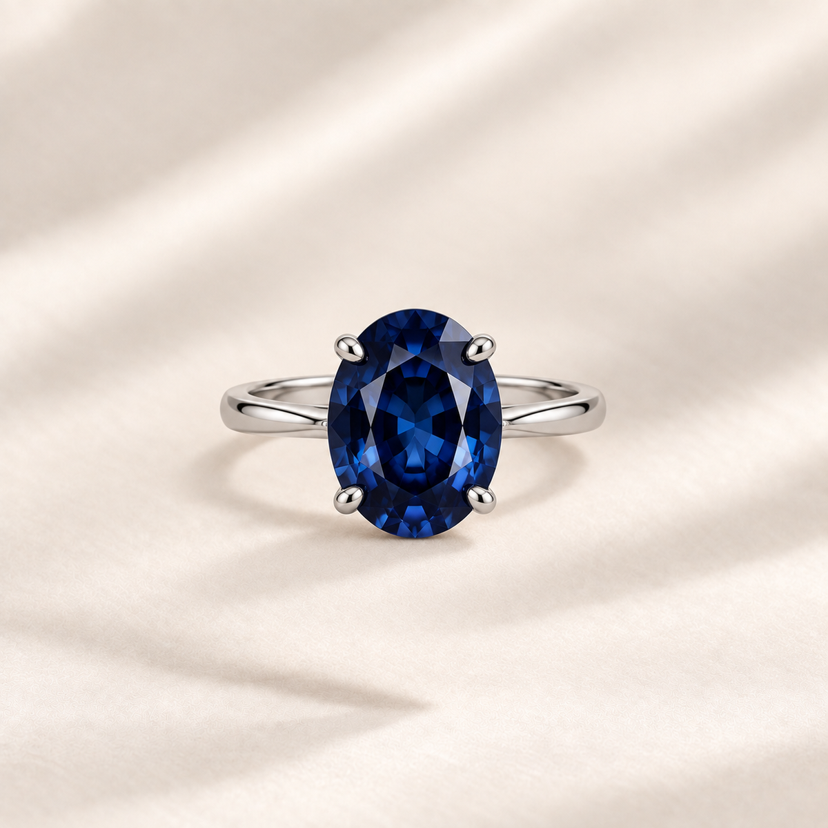 Philologi oval lab grown sapphire ring 3ct on warm ivory silk