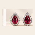 Philologi pear lab corundum stud earrings on warm ivory silk