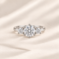 Philologi round moissanite three-stone ring with 2ct centre on warm ivory silk