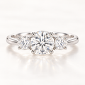 Round moissanite three-stone ring in 925 sterling silver, front view